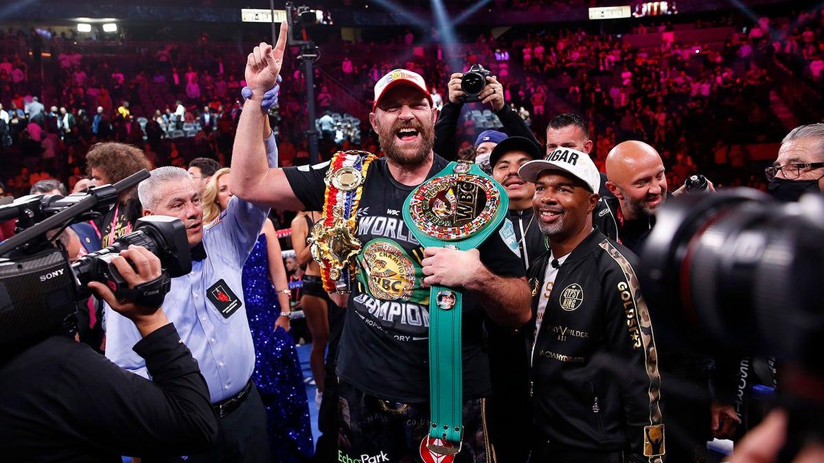 Tyson Fury, of England, celebrates after defeating Deontay Wilder in a heavyweight championship boxing match Saturday, Oct. 9, 2021, in Las Vegas.