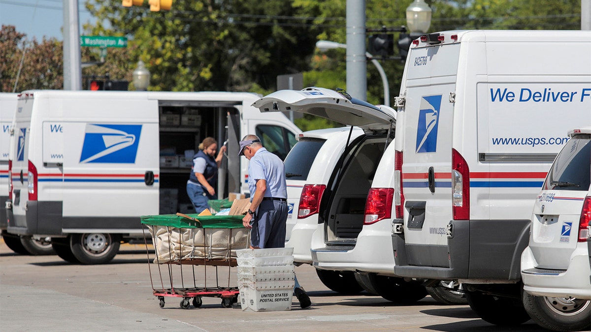 USPS workers handling mail