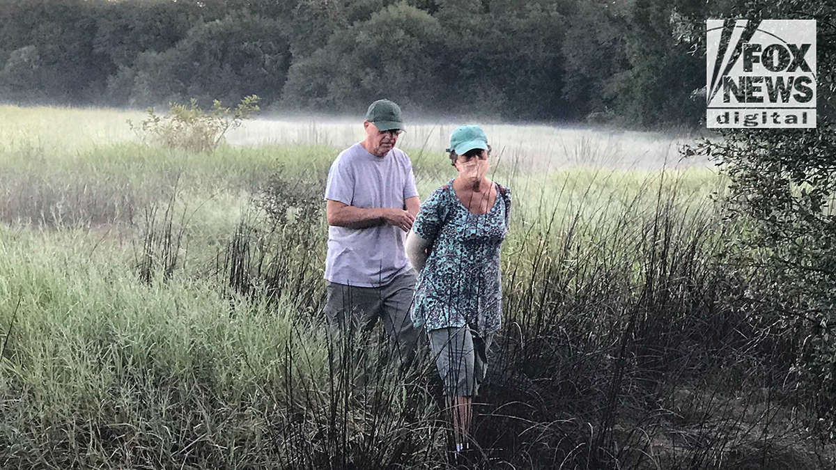  Chris and Roberta Laundrie in the Myakkahatchee Creek Environmental Park, searching for signs of their son Brian