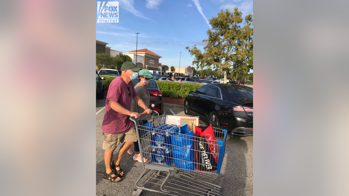 Chris and Roberta Laundrie with shopping cart