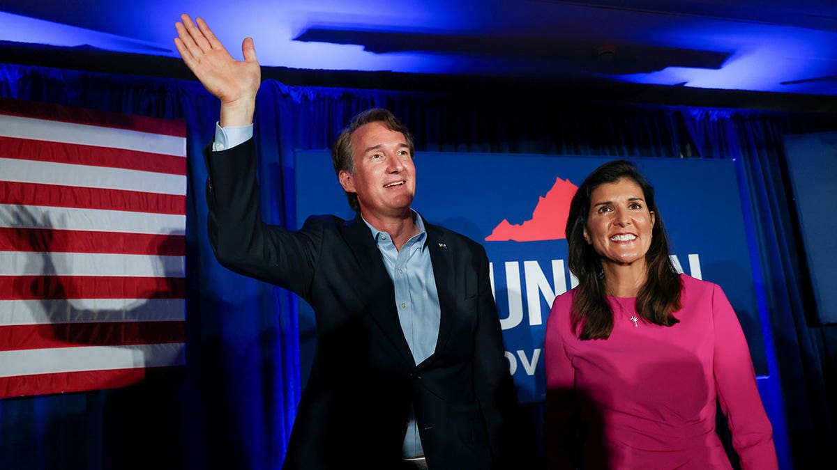 Virginia gubernatorial candidate Glenn Youngkin (R-VA), waves to the crowd at a campaign event with Nikki Haley, the former Governor of South Carolina and Ambassador to the UN, in McLean, Virginia, U.S., July 14, 2021. REUTERS/Evelyn Hockstein