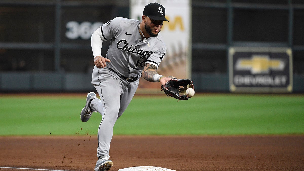 Chicago White Sox third baseman Yoán Moncada fields a ground ball by Houston Astros second baseman Jose Altuve during the third inning in Game 2 of an American League Division Series game Friday, Oct. 8, 2021, in Houston.  