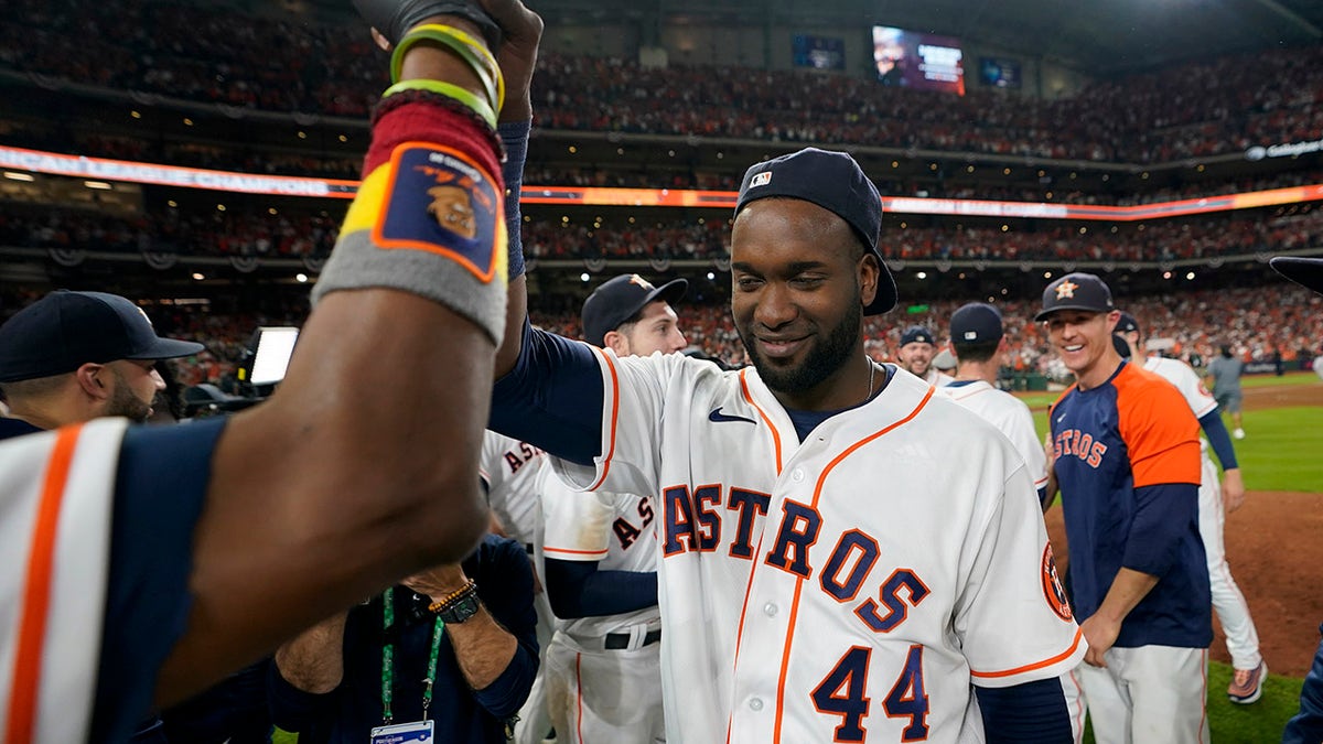 Houston Astros designated hitter Yordan Alvarez celebrates after their win against the Boston Red Sox in Game 6 of baseball's American League Championship Series Friday, Oct. 22, 2021, in Houston. The Astros won 5-0, to win the ALCS series in game six. 