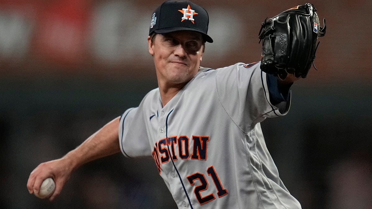 Houston Astros starting pitcher Zack Greinke throws during the first inning in Game 4 of baseball's World Series between the Houston Astros and the Atlanta Braves Saturday, Oct. 30, 2021, in Atlanta.