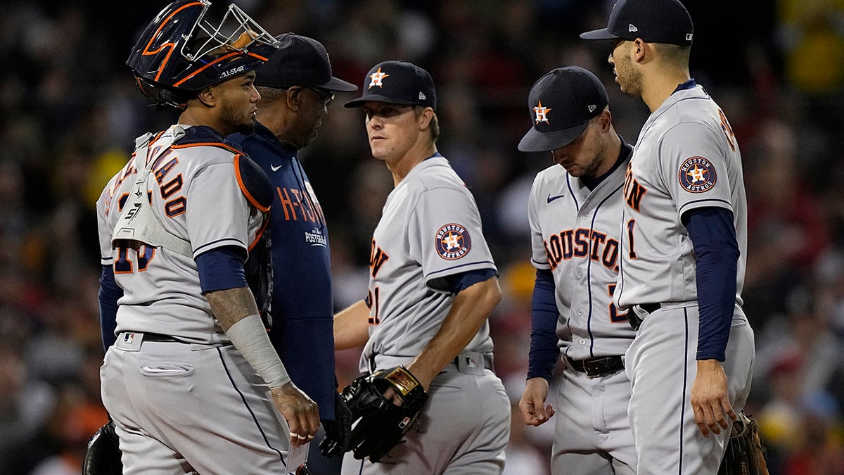 Houston Astros starting pitcher Zack Greinke is taken out of the game against the Boston Red Sox during the second inning in Game 4 of baseball's American League Championship Series Tuesday, Oct. 19, 2021, in Boston.