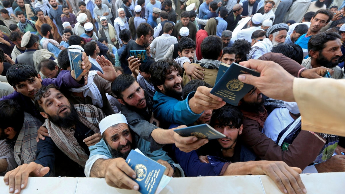 An Afghan crowd becomes chaotic as they vie for visas.