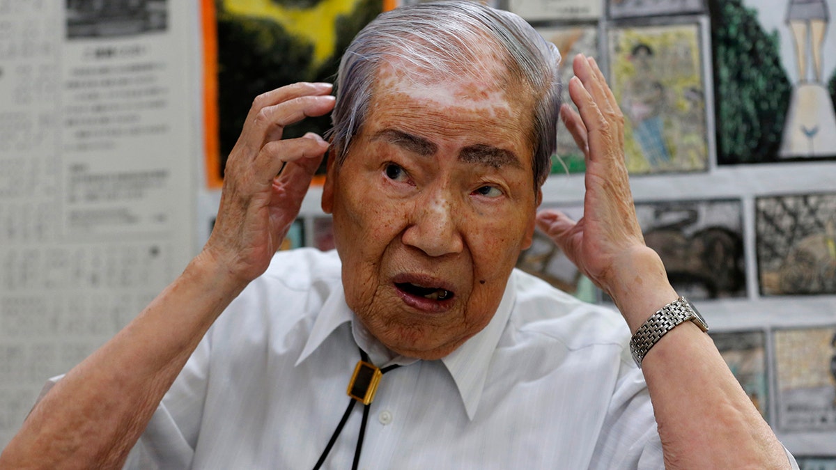 In this photo from August 2013, Sunao Tsuboi, then co-chairperson of Japan Confederation of A-and H-Bomb Sufferers Organizations, speaks during an interview at his office in Hiroshima, western Japan. 