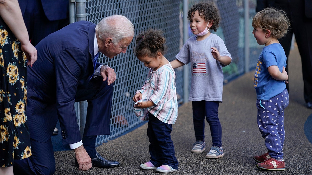 President Joe Biden greets children as he visits the Capitol Child Development Center, Friday, Oct. 15, 2021, in Hartford, Conn.