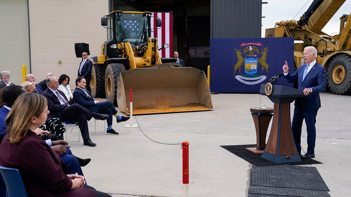 President Biden delivers remarks on his "Build Back Better" agenda during a visit to the International Union Of Operating Engineers Local 324, Tuesday, Oct. 5, 2021, in Howell, Mich. In foreground at left is U.S. Rep. Elissa Slotkin, D-Mich.