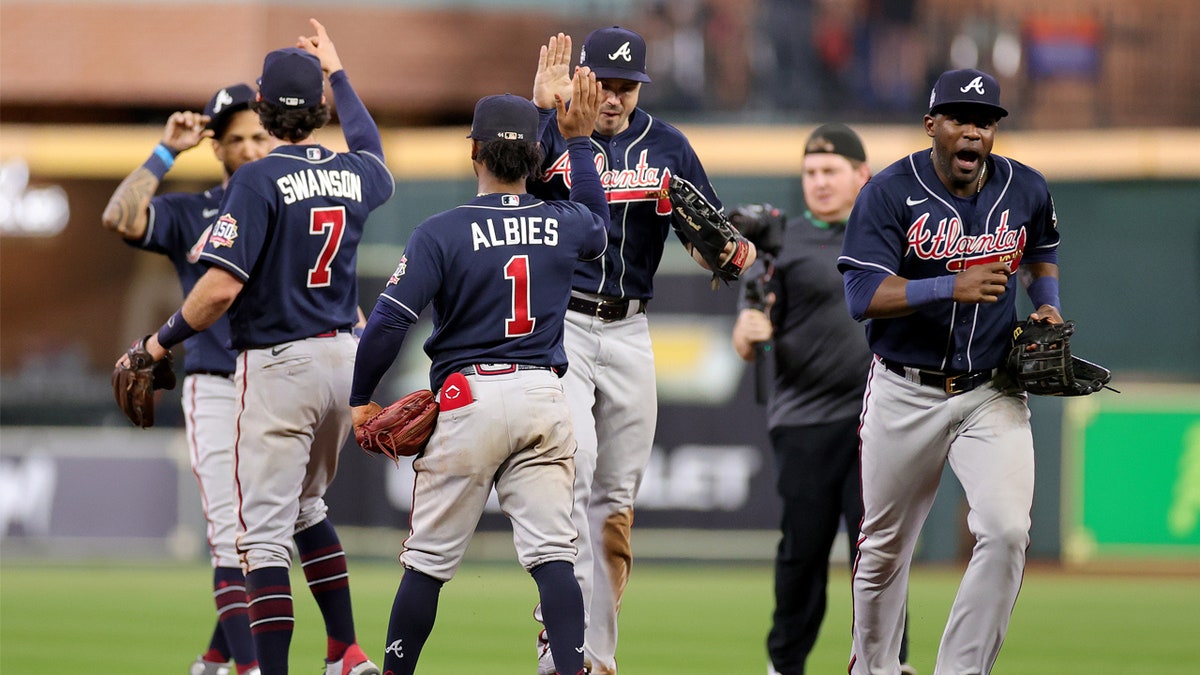 Braves become 1st MLB team to clinch playoff spot as Acuña and