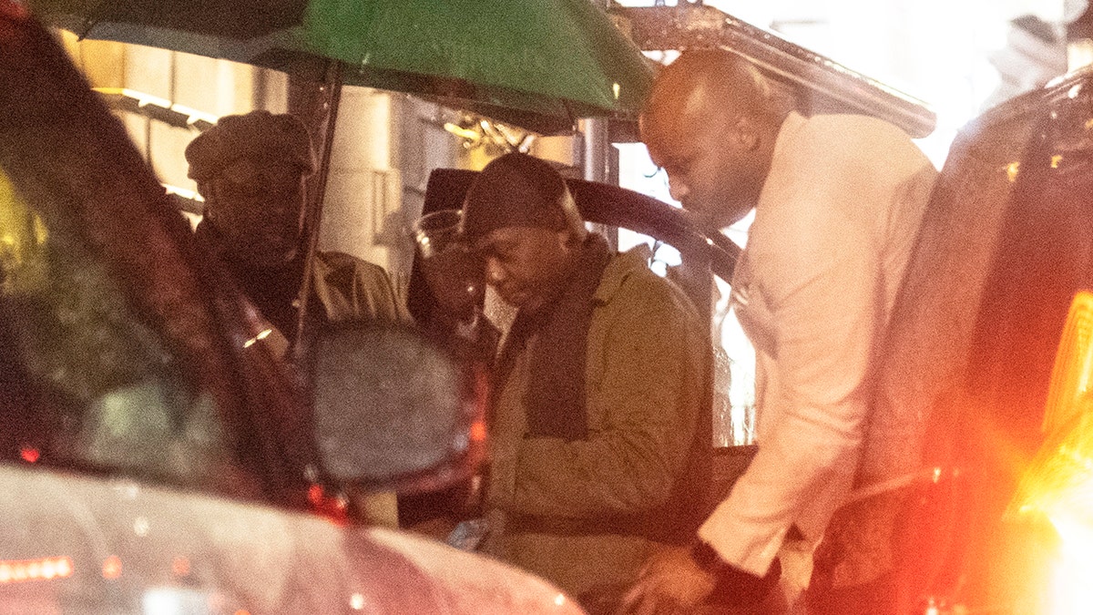 It is his first sighting since the Netflix protest up this week, Chappelle (center) had a strong security presence in London after a sold-out show. 