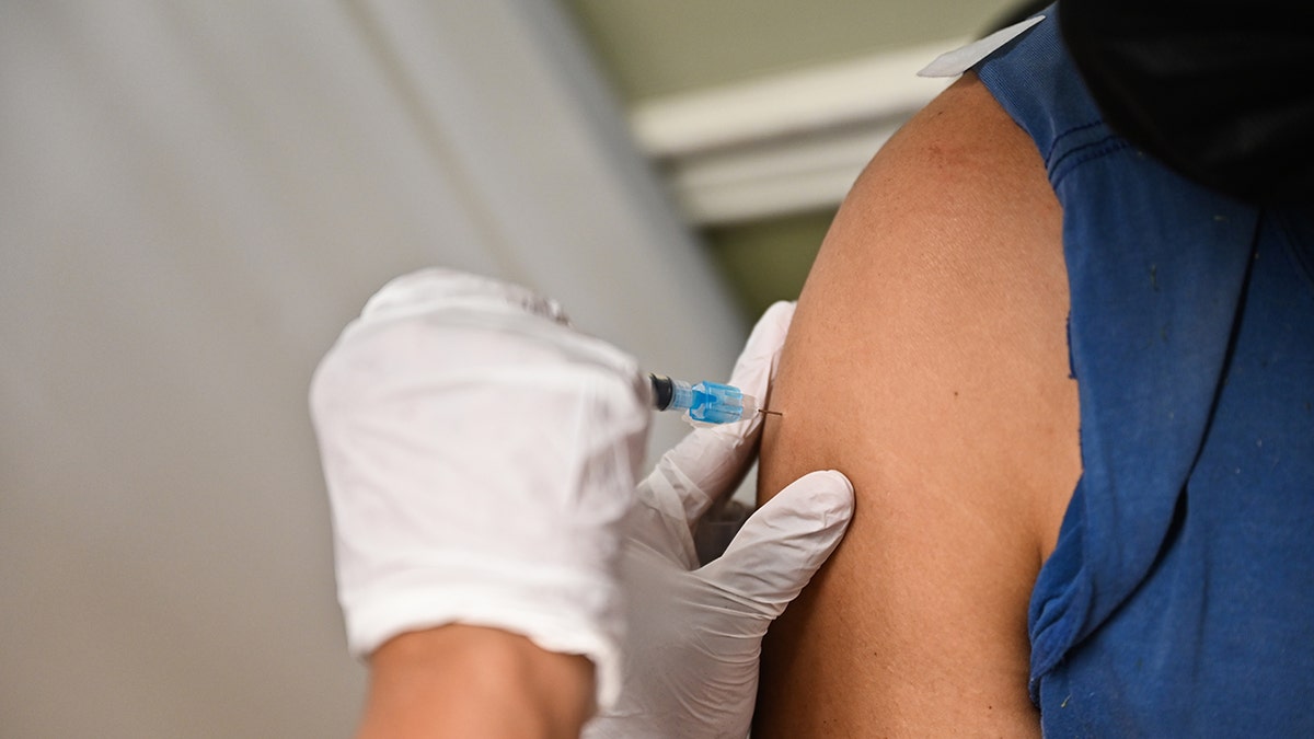 A man receives the Moderna COVID-19 vaccine while at a federally qualified health center in Westbury, New York, April 29, 2021. 