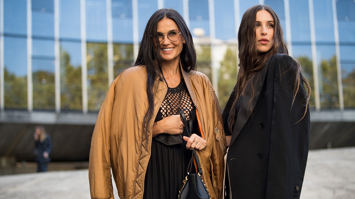 Demi Moore (L) and Scout Willis (R) attend attend the Stella McCartney Womenswear Spring/Summer 2022 show as part of Paris Fashion Week on October 04, 2021 in Paris, France.