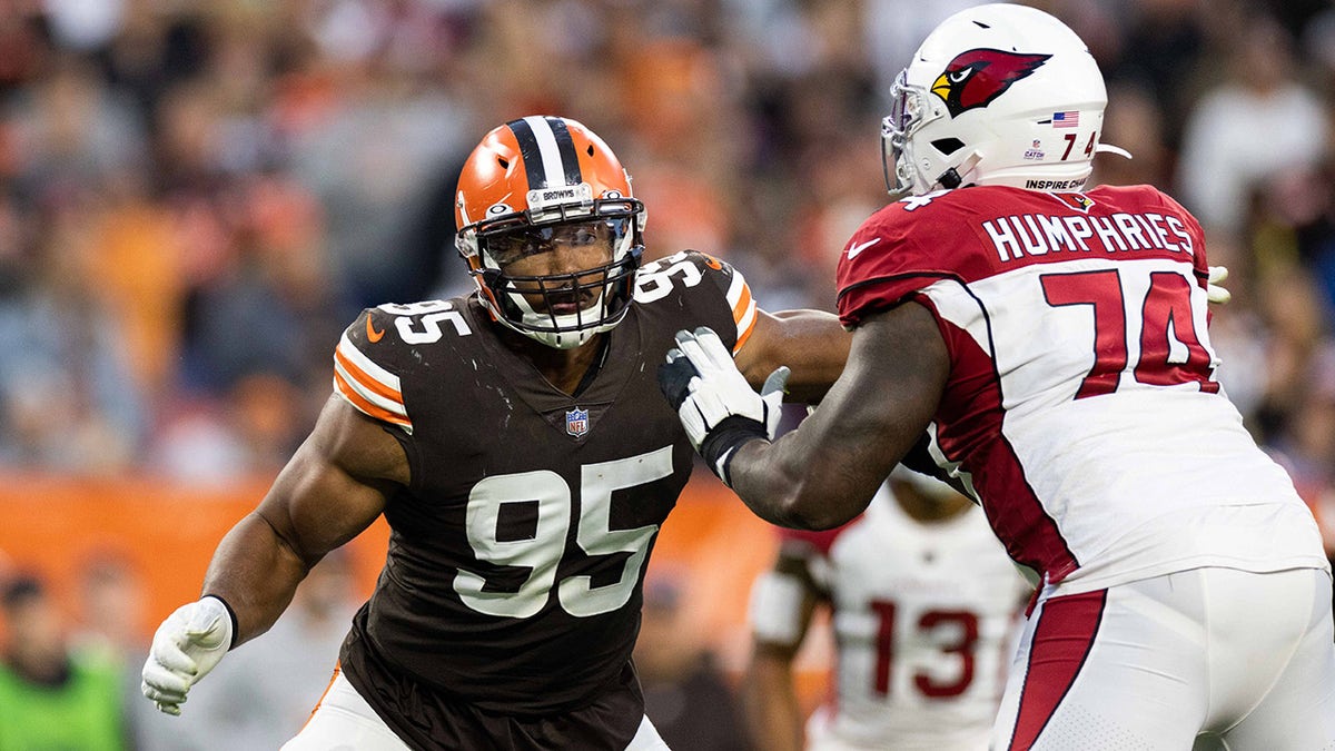 Cleveland Browns defensive end Myles Garrett steps around Arizona Cardinals offensive tackle D.J. Humphries during the fourth quarter at FirstEnergy Stadium in Cleveland, Ohio, on Oct. 17, 2012.