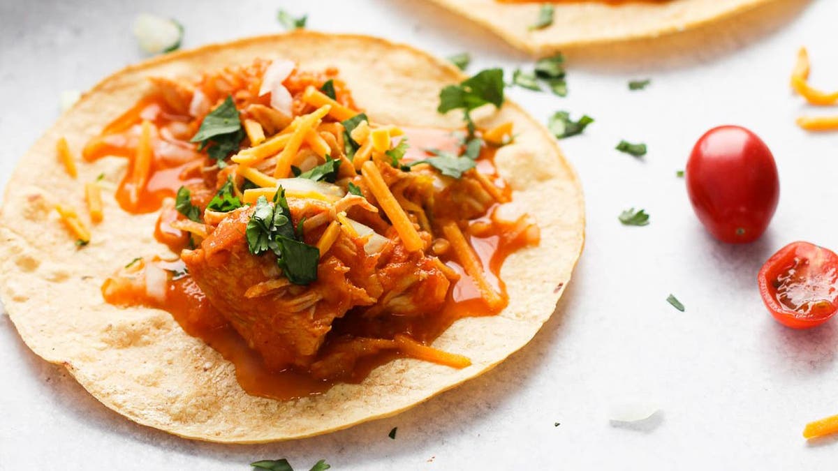Chelsea Plummer's Instant Pot chicken taco recipe includes salsa, yellow onions, tomato paste and delectable seasonings.