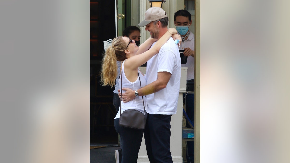 Parents-to-be Jennifer Lawrence and husband Cooke Maroney look all loved up while having a sweet PDA moment after having lunch in downtown Manhattan.