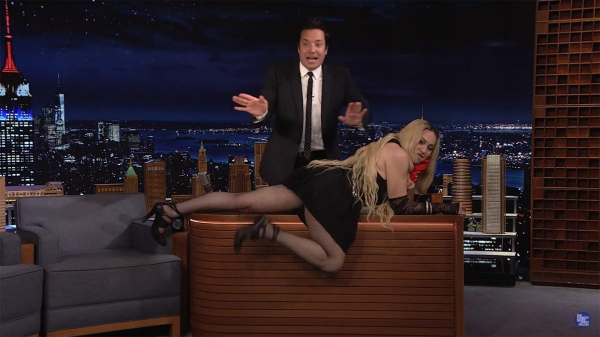 Madonna wreaked havoc during her appearance on "The Tonight Show" Thursday when she crawled across host Jimmy Fallon’s desk and flashed her tush to the audience.