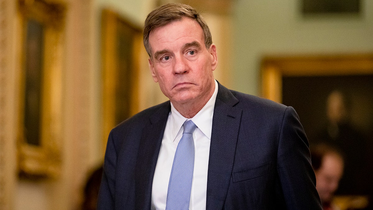 Sen. Mark Warner (D-VA) returns to the Senate floor following a recess in the Senate impeachment trial of President Donald Trump in January 2020. Warner said that Intelligence was accurate in showing the trajectory of the Taliban's takeover of Afghanistan. 