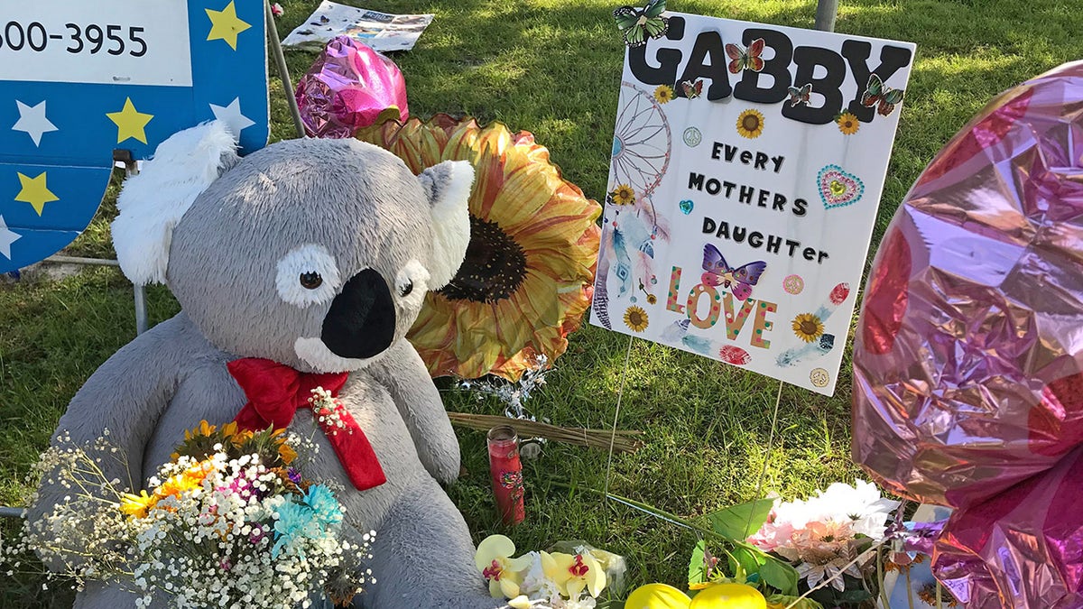 A memorial for Gabby Petito grows near City Hall in North Port, Florida with heartfelt messages left in her memory.