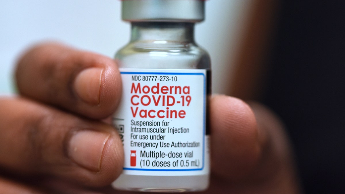 Dr. Salma Elfaki holds a vial of Moderna COVID-19 vaccine at a Moderna clinical trial for adolescents being conducted by Accel Research Sites with Nona Pediatric Center in Orlando, Florida. Recently, a judge denied a bid to stop Oregon's vaccine mandate.
