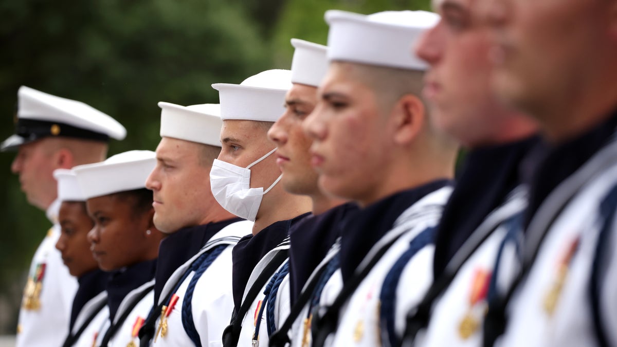 Navy sailors stand in formation