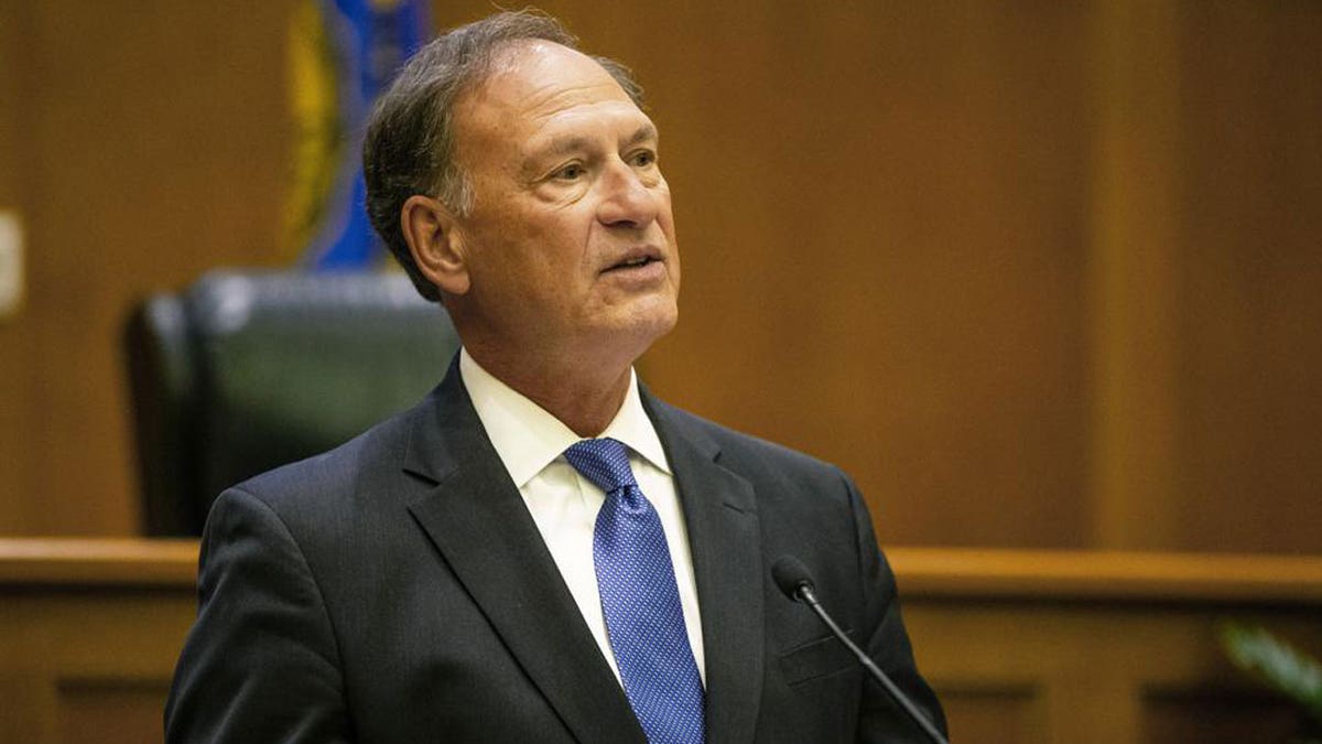 Supreme Court Justice Samuel Alito addresses the audience during the "The Emergency Docket" lecture Thursday, Sept. 30, 2021 in the McCartan Courtroom at the University of Notre Dame Law School in South Bend, Ind. 
