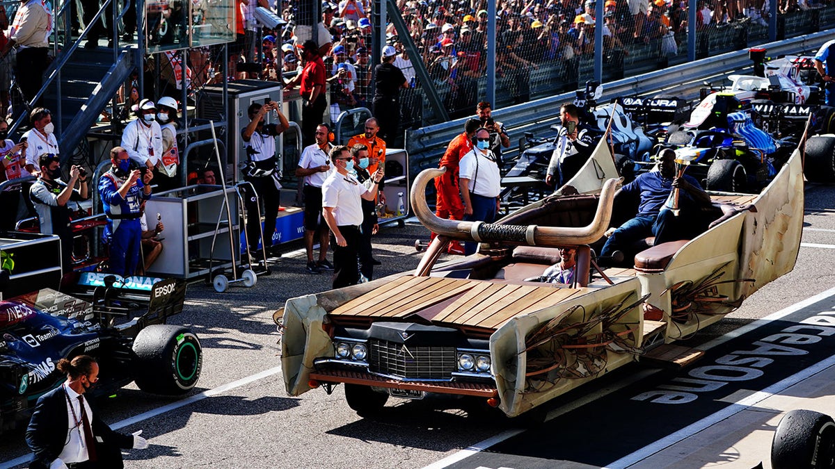 Shaq delivered the winner's trophy in a custom Cadillac.