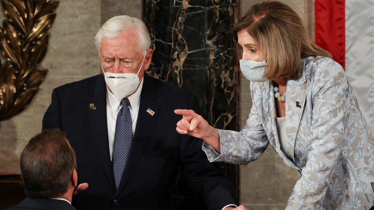 U.S. House Majority Leader Steny Hoyer (D-MD) and Speaker of the House Nancy Pelosi (D-CA) wait during votes at the first session of the 117th Congress in the House Chamber at the U.S. Capitol in Washington, DC, U.S., January 3, 2021. Tasos Katopodis/Pool via REUTERS