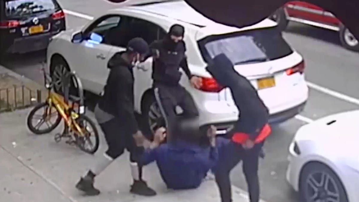 Photo of trio of assailants stabbing a victim, photo courtesy of the NYPD's DCPI.