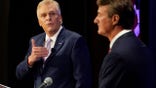 Democratic gubernatorial candidate former Governor Terry McAuliffe, left, gestures as Republican challenger, Glenn Youngkin, listens during a debate at the Appalachian School of Law in Grundy, Va., Thursday, Sept. 16, 2021. (AP Photo/Steve Helber)