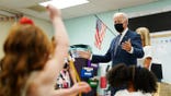 President Joe Biden talks to students during a visit to East End Elementary School to promote his "Build Back Better" agenda, Monday, Oct. 25, 2021, in North Plainfield, N.J. (AP Photo/Evan Vucci)