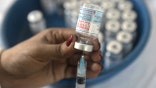 DHAKA, BANGLADESH - SEPTEMBER 8, 2021: A nurse prepares  the  Moderna  vaccine Booster Dose,  during a Mass vaccination campaign at a vaccination center. On September 8, 2021 in Dhaka, Bangladesh.  (Photo credit should read Sazzad Hossain / Eyepix Group/Barcroft Media via Getty Images)