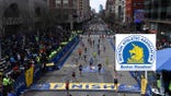 FILE PHOTO: Runners approach the finish line on Boylston Street during the 123rd Boston Marathon in Boston, Massachusetts, U.S., April 15, 2019. REUTERS/Gretchen Ertl/File Photo