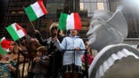 FILE - In this Oct. 8, 2012 file photo, people ride on a float with a large bust of Christopher Columbus during the Columbus Day parade in New York.  Monday, Oct. 11, 2021 federal holiday dedicated to Christopher Columbus continues to divide those who view the explorer as a representative of Italian Americans’ history and those horrified by an annual tribute that ignores the native people whose lives and culture were forever changed by colonialism.(AP Photo/Seth Wenig, File)