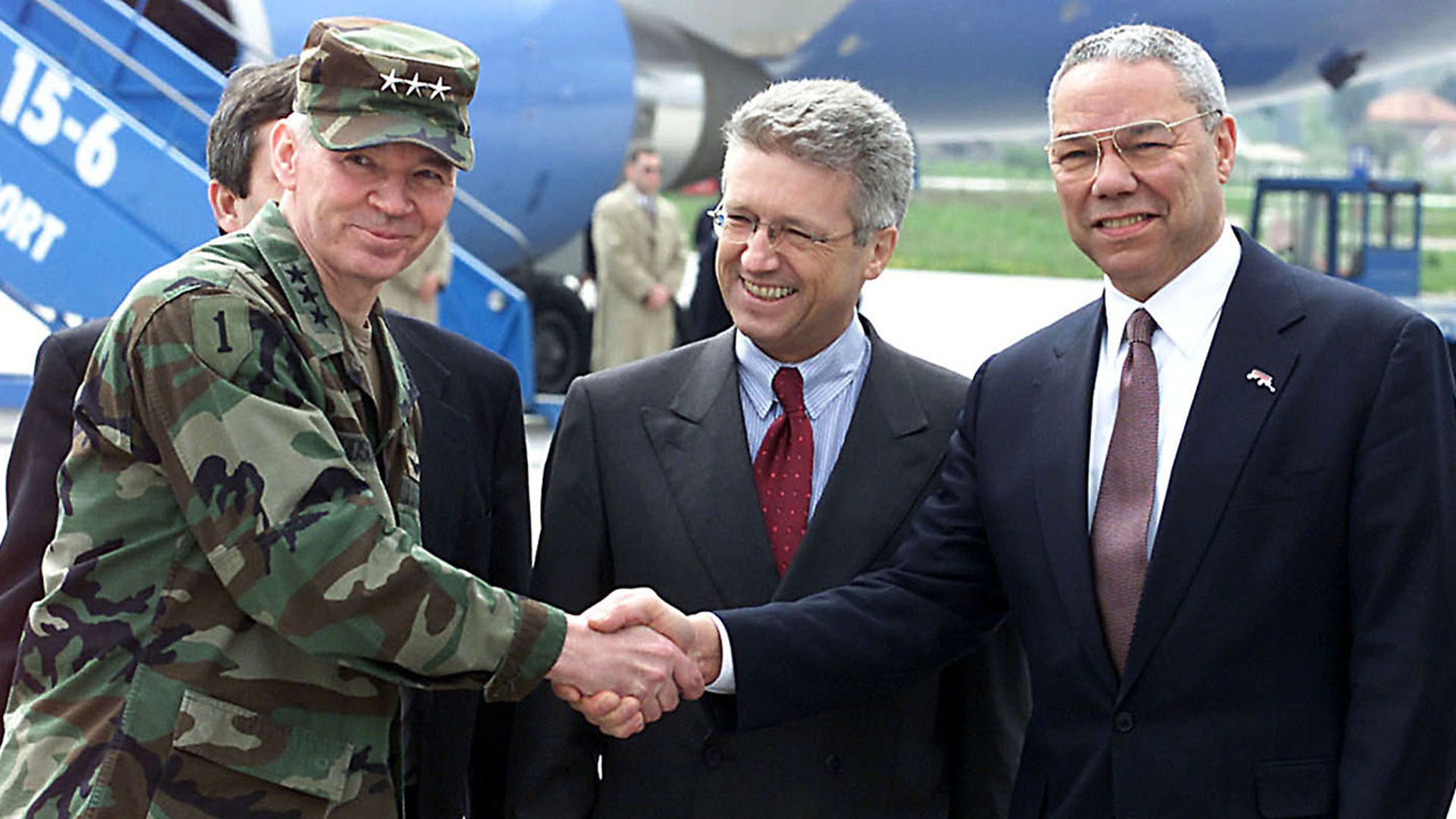 U.S. Secretary of State Colin Powell (3R), on his first trip to the Balkans, meets the international community's High Representative to Bosnia Wolfgang Petritsch (C) and Commander of the NATO-led Stabilisation Force (SFOR) General Michael Dodson (L), at the Sarajevo airport, April 13, 2001. MZ
