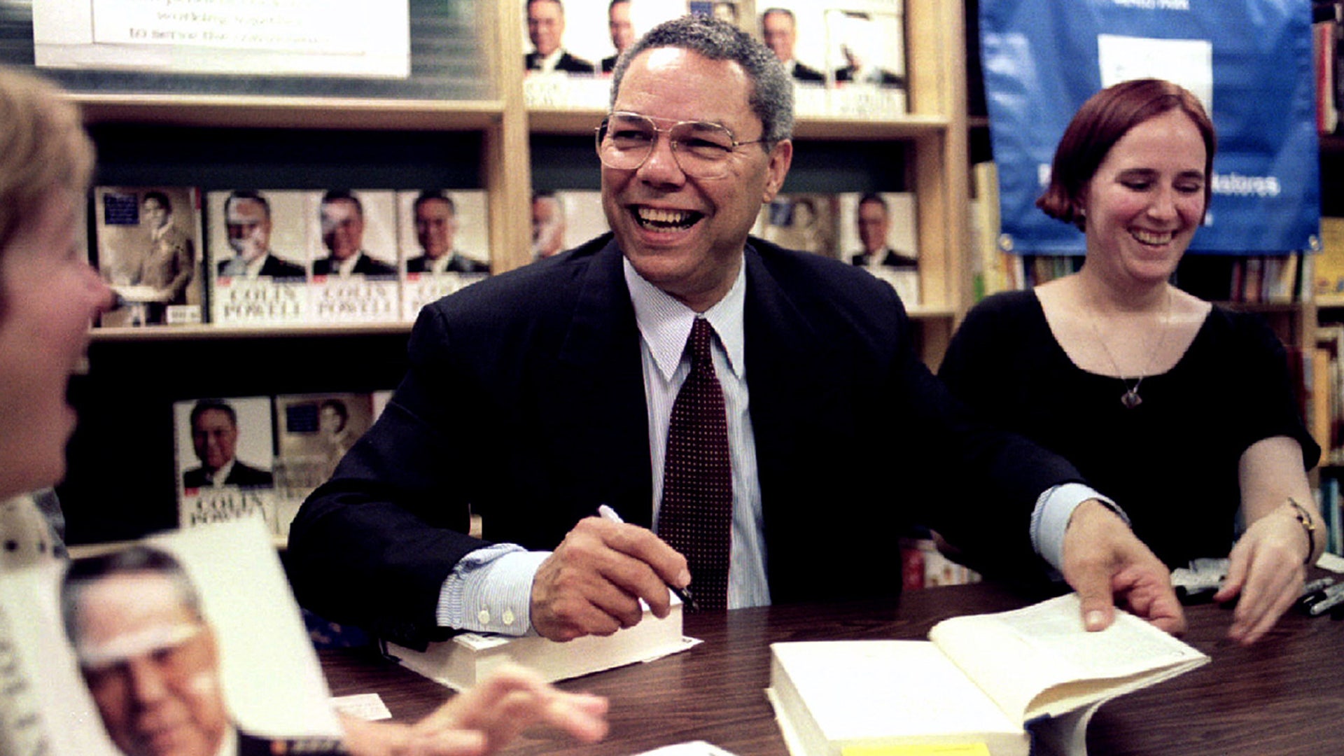 General Colin Powell, retired Chairman of the Joint Chiefs of Staff, signs a book in San Francisco September 25