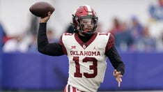 No. 3 Oklahoma holds off Kansas 35-23 behind Williams' runs