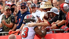 Bucs fan who mistakenly received Tom Brady's 600th TD pass says he just wants to hit the links with the star