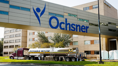 Largest Louisiana health system fines employees with unvaccinated spouses