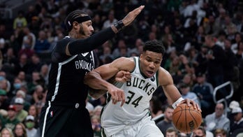 Bucks begin title defense with 127-104 victory over Nets
