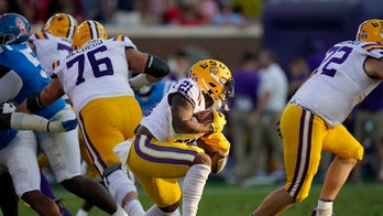 Fan at LSU-Ole Miss game hands off pricey shades during viral brawl in stands: report