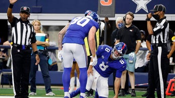 Giants' Daniel Jones wobbly after helmet-to-helmet play, leaves field on cart