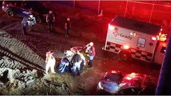 Atlanta police officer crashed into gate to get to motorist in ravine