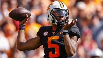 Hooker throws three TDs, leads Tennessee past South Carolina