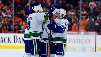 Canucks score twice in shootout, beat Flyers 5-4