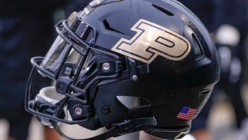 Purdue cheerleader belly flops into puddle as rain pours