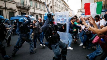Rome protesters clash with police as thousands pack the streets in opposition to COVID vaccine rule