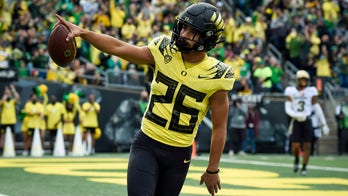 Brown throws for 3 TDS and No. 7 Oregon downs Colorado 52-29