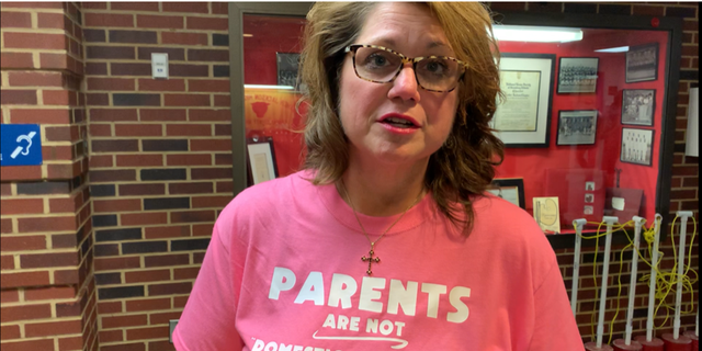 Elizabeth L. Schultz, a member of the Fairfax County School Board for 8 years, wearing a "Parents are not domestic terrorists" t-shirt.