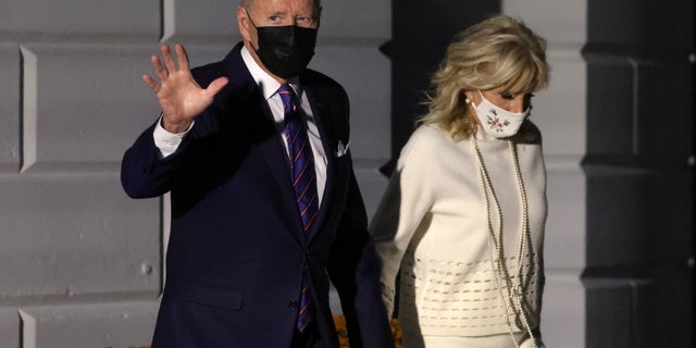WASHINGTON, DC - OCTOBER 21: U.S. President Joe Biden walks with first lady Jill Biden prior to a Marine One departure for Baltimore, Maryland, October 21, 2021 at the White House in Washington, DC. President Biden is scheduled to participate in a town hall in Baltimore where he will discuss the Bipartisan Infrastructure Deal and Build Back Better agenda with Americans. (Photo by Alex Wong/Getty Images)